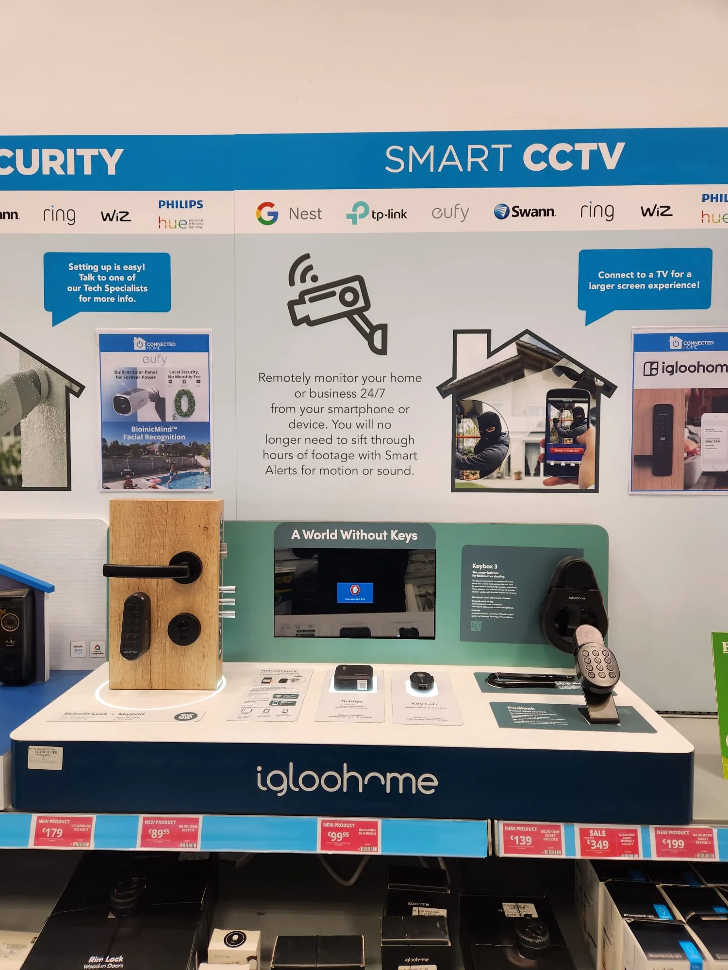 Harvey Norman smart security wall with an igloohome connected-access display and related smart-home brands