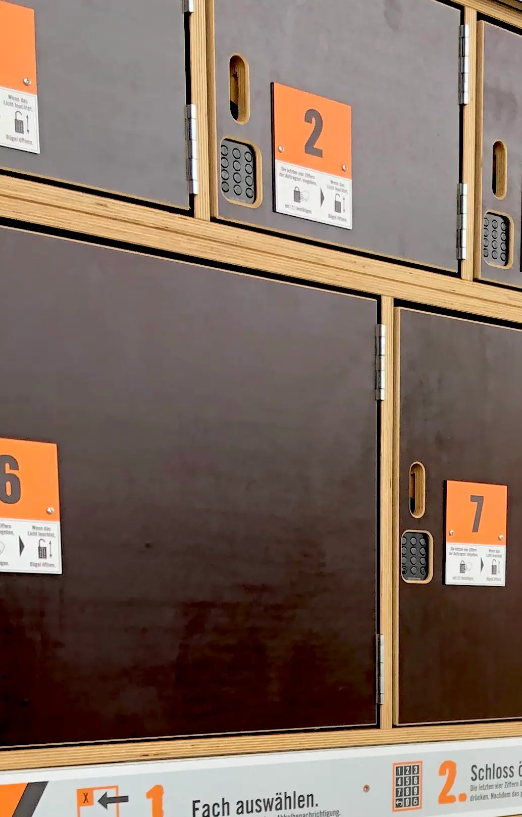 Close-up of several numbered Hornbach collection compartments fitted with connected keypad locks